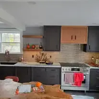 Charcoal kitchen with wood accents and subway tile, a higher-end custom look
